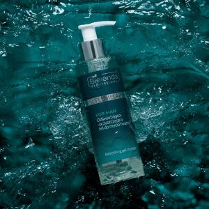 Bielenda men's facial cleanser, pictured in a 200ml pump bottle splashing into water. The face wash is from their 2023 male grooming line.
