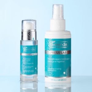 Product shot of the Soothing Hydro Serum and Hydrating & Toning Mist from SUPREMELAB. Both products are shown against a light blue background with water droplets running down their packaging, giving a feeling of moisture and hydration.